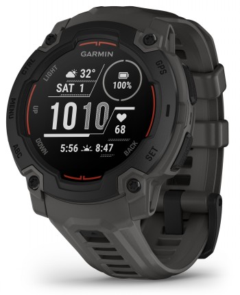 Black Garmin Instinct E smartwatch, round display and grey strap, oblique view.