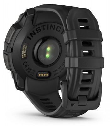 Stylish black back cover and strap of the Garmin Instinct 3 smartwatch Details of the black silicone strap and back cover of the new Garmin Instinct 3, featuring a sensor and charging pins.