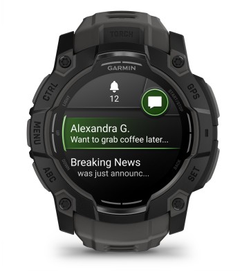 Garmin Instinct 3 smartwatch, AMOLED display, and black strap Close-up of a black Garmin Instinct 3 smartwatch with message content on the display and a black strap.
