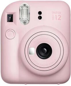 Pink Fujifilm Instax Mini 12 instant camera pictured from the front, lens and flash visible.