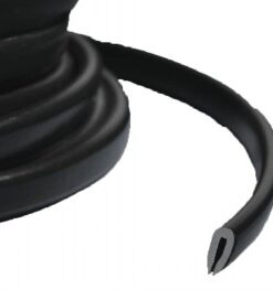Black flexible edge protector, rolled into a coil, a close-up showing the complete cutting profile.
