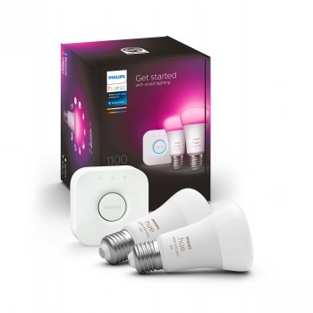 Philips Hue starter kit with two white smart bulbs and a bridge, product packaging in the background.