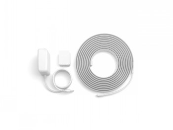 Philips Hue Solo Lightstrip 5m EU LED strip and accessories White Philips Hue Solo Lightstrip 5m LED strip, power supply, and cable placed on a table, viewed from above.