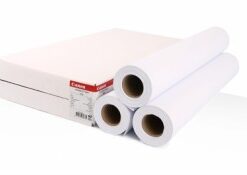 Canon 1570B large format printer paper rolls and box Three white large format printer paper rolls and a Canon-branded box in the background.