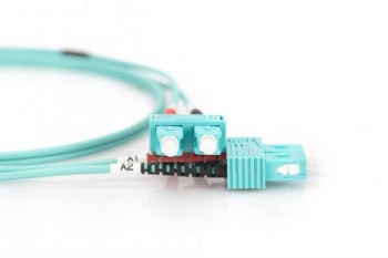 Digitus duplex SC-SC OM3 1 m fiber optic cable, close-up. Light blue duplex SC-SC fiber optic cable, close-up of the connector, white background.