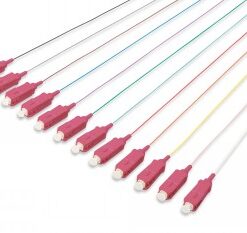 12 pieces of multimode fiber OM4 cables with pink SC connectors, aligned side by side on a white ...