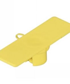 A yellow rectangular cable tag with a small attachment loop, placed on a tabletop.