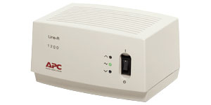 APC Line-R 1200VA voltage regulator, modern and practical design. Beige APC Line-R 1200VA voltage regulator, LED lights and switch on the front.