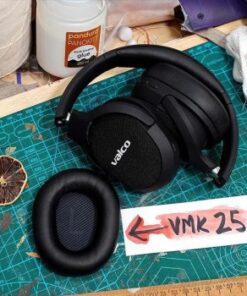 Black replacement earpads for VMK25 headphones on a table, with crafting supplies in the background.