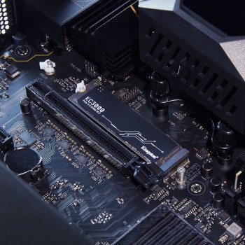 Kingston KC3000 NVMe SSD installed on a motherboard Kingston KC3000 NVMe SSD installed on a motherboard. The black SSD is visible in a close-up in the connector.