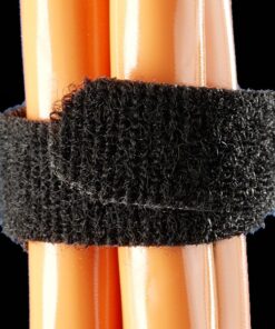 Black hook-and-loop tape rolled around orange cables against a black background.