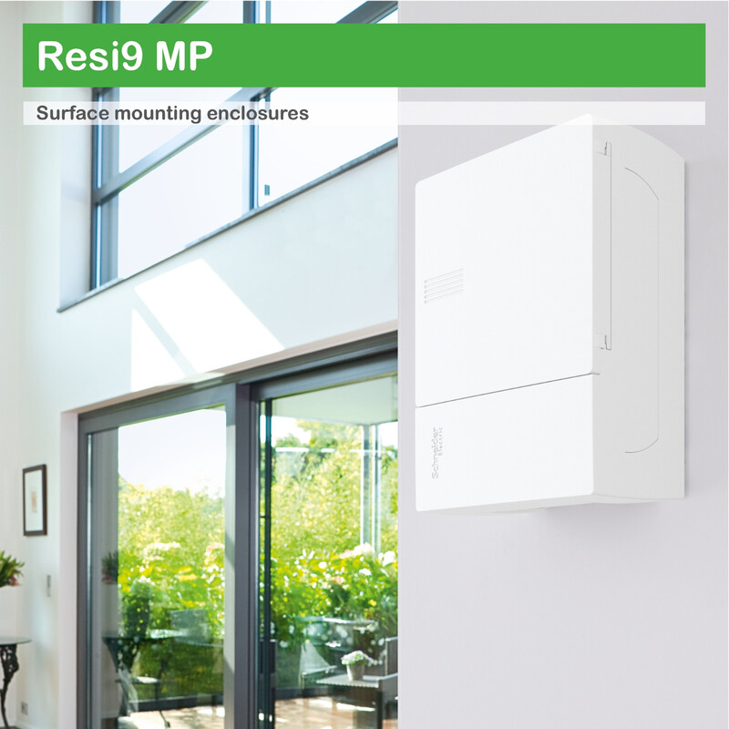 Schneider Electric Mini Pragma surface-mounted distribution board in a bright space A white Schneider Electric Mini Pragma distribution board, installed on a white wall next to a bright window wall.